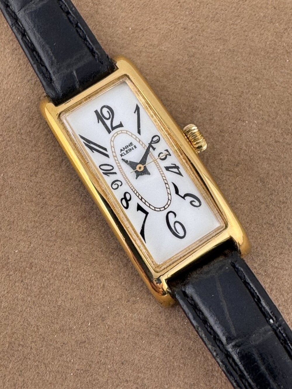 Anne Klein Gold Tone Curvature Tank Watch Large Numerals Black Strap